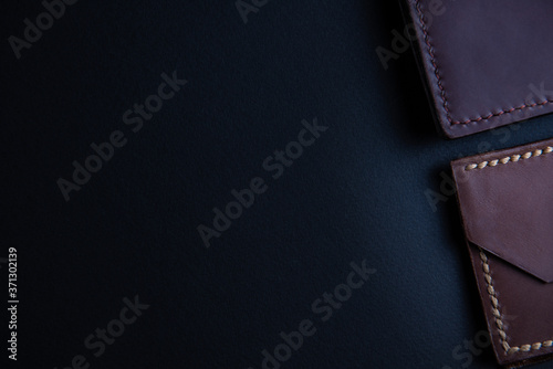 background from leather products on a black background with a place for an inscription. Leather craft concept.