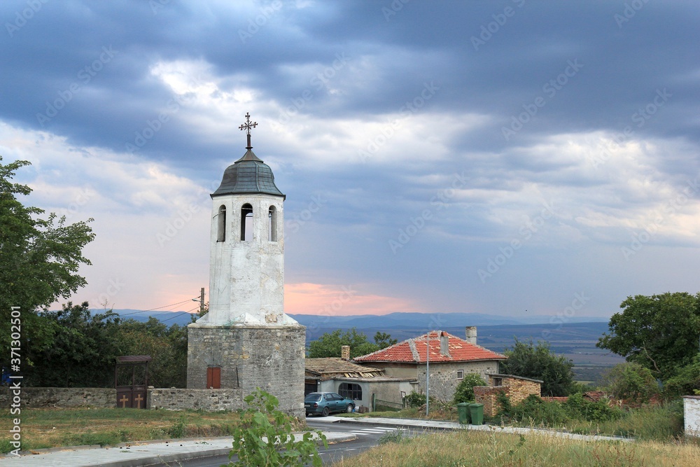 Church in the village of Avren (Bulgaria) in the evening at sunset