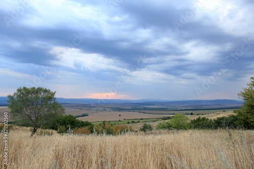 View of the plain from a height in the vicinity of the village of Avren (Bulgaria) at sunset