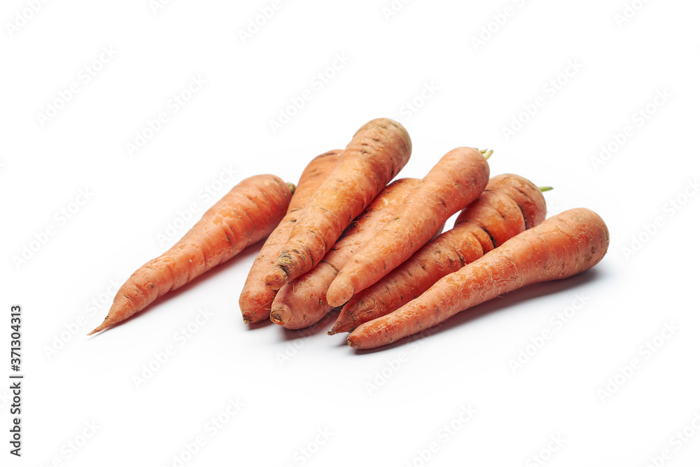 Heap of fresh raw carrots isolated on white background