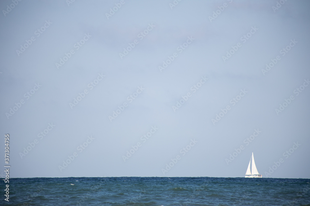 white sailing ship in sea