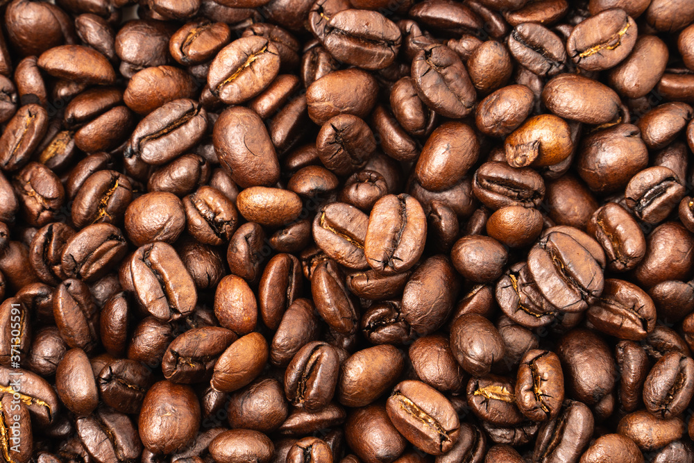 Naklejka premium roasted coffee beans, can be used as a background..