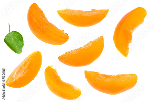 apricot fruits with slices and green leaf isolated on white background. top view. flat lay