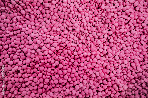 Fototapeta Naklejka Na Ścianę i Meble -  Lots of pink pills. Abstract medical picture. Background image