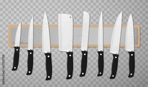 Knife, chopper, carver, slicer with black handles of different sizes are on chopping, cutting board.