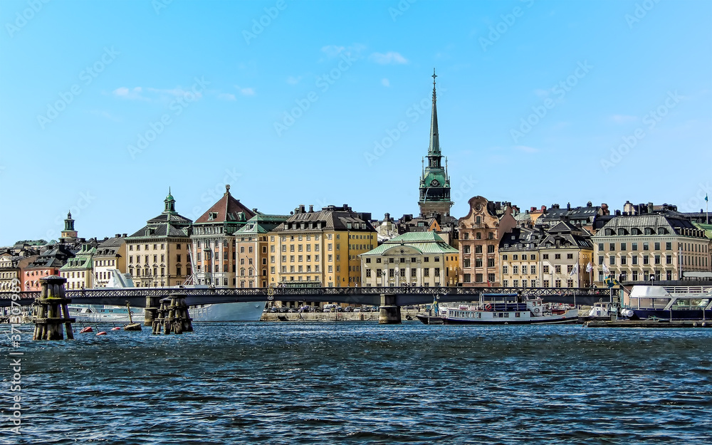 Fototapeta premium A view from a boat toward the shore of the Swedish capital, Stockholm in the summertime