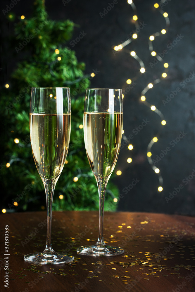 Two champagne glasses ready to celebrate in New Year Two champagne glasses ready to celebrate in New Year
