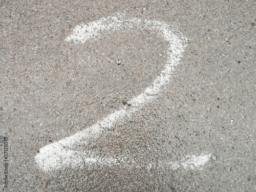 Number written with chalk on the pavement