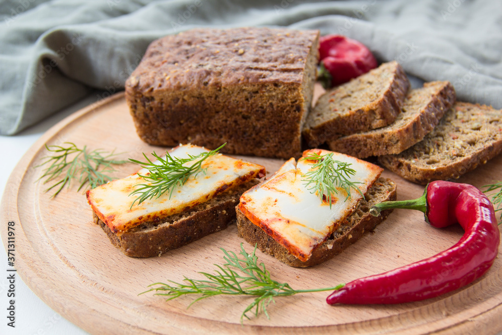 Delicious bread with garlic, lard, herbs, and chili Delicious bread with garlic, lard, herbs, and chili