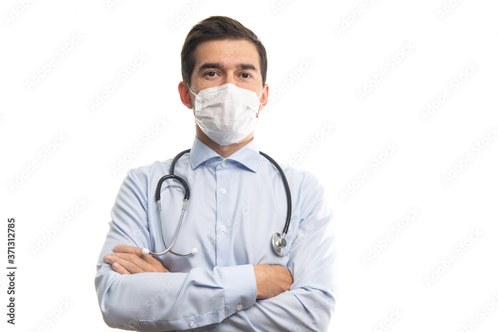Young male caucasian doctor with stethoscope posing with crossed arms isolated on white background Young male caucasian doctor with stethoscope posing with crossed arms isolated on white background