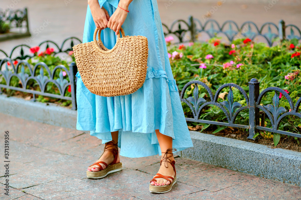 Close up fashion street details of tender stylish woman posing at Europe  city, wearing blue maxi dress, straw hat and gladiator sandals, summertime.  Stock Photo | Adobe Stock