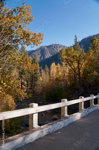 Fall colors in Hope Valley, California, with a bridge in the foreground and mountain in the background