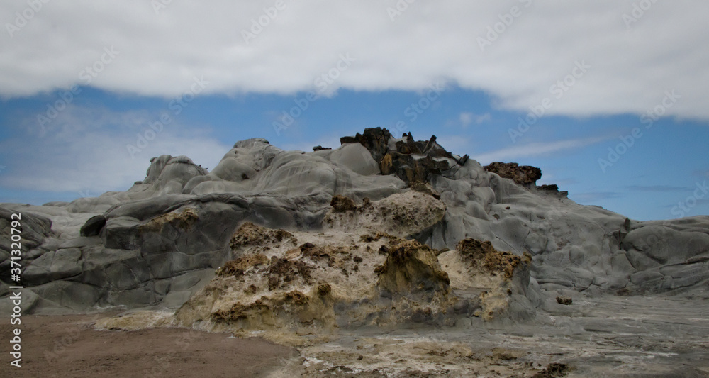 Mound of different volcanic materials near the coast