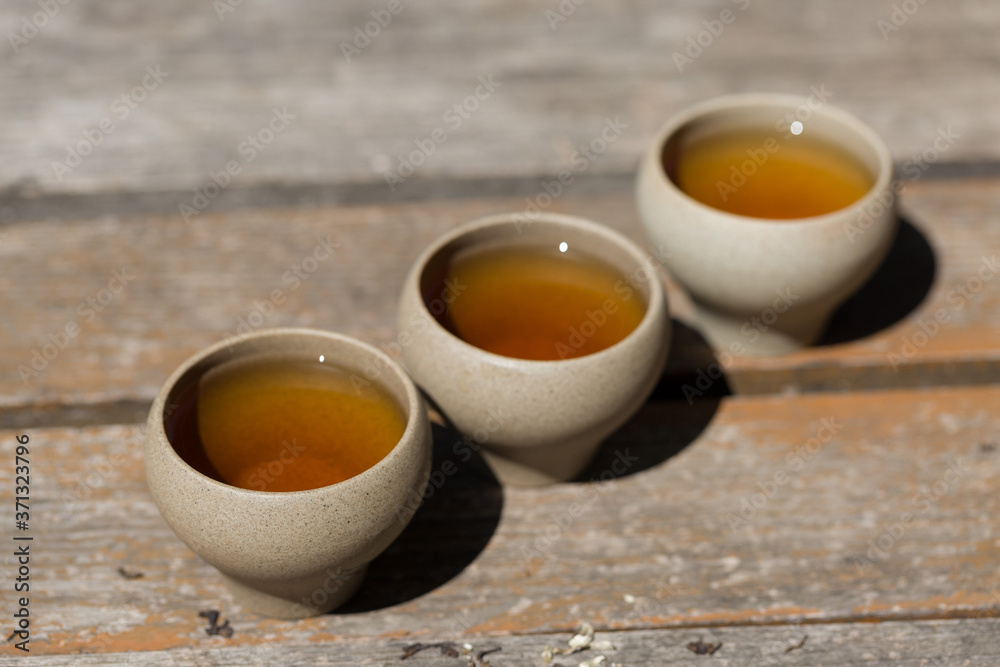 Ceramic bowls made of clay on a wooden background. Ceramic bowls made of clay on a wooden background.