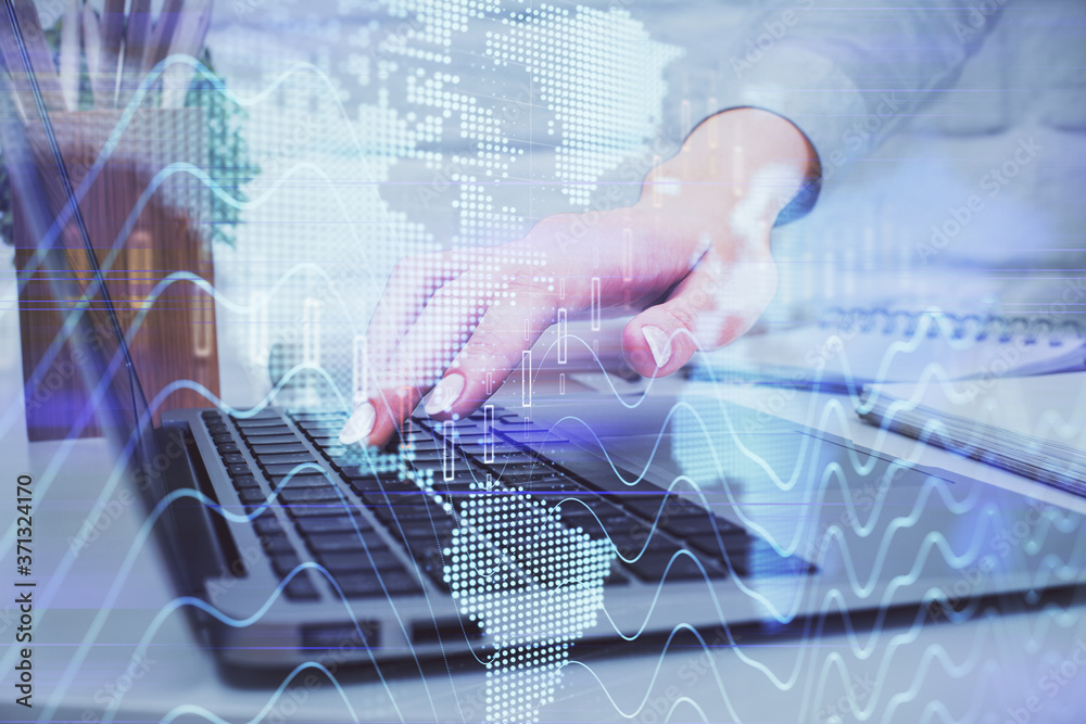 Multi exposure of woman hands typing on computer and forex chart hologram drawing. Stock market analysis concept.