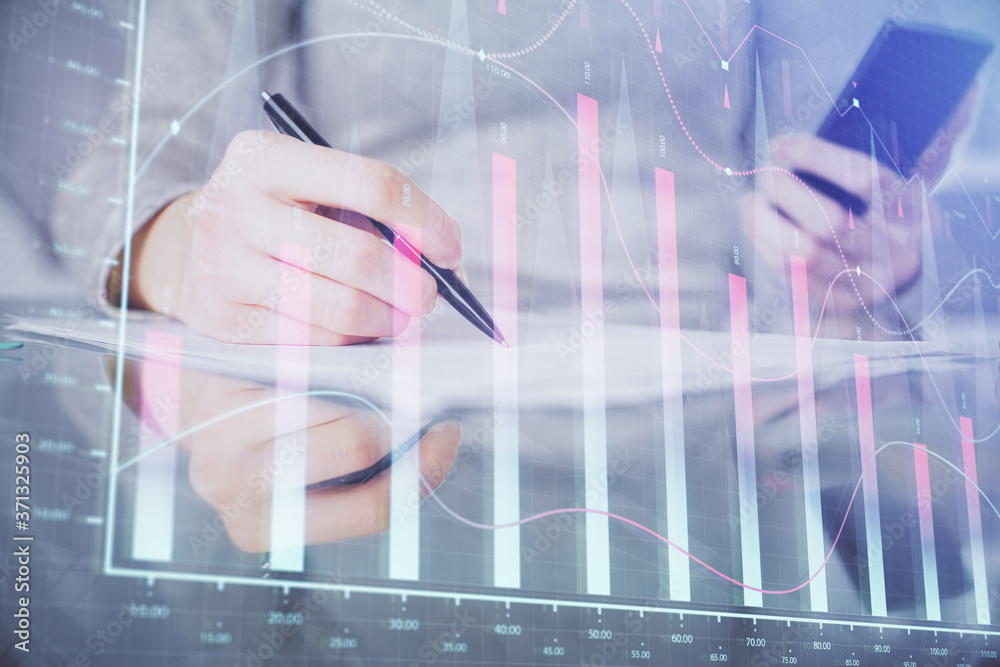 Double exposure of forex chart sketch hologram and woman holding and using a mobile device. Financial market concept. Double exposure of forex chart sketch hologram and woman holding and using a mobile device. Financial market concept.