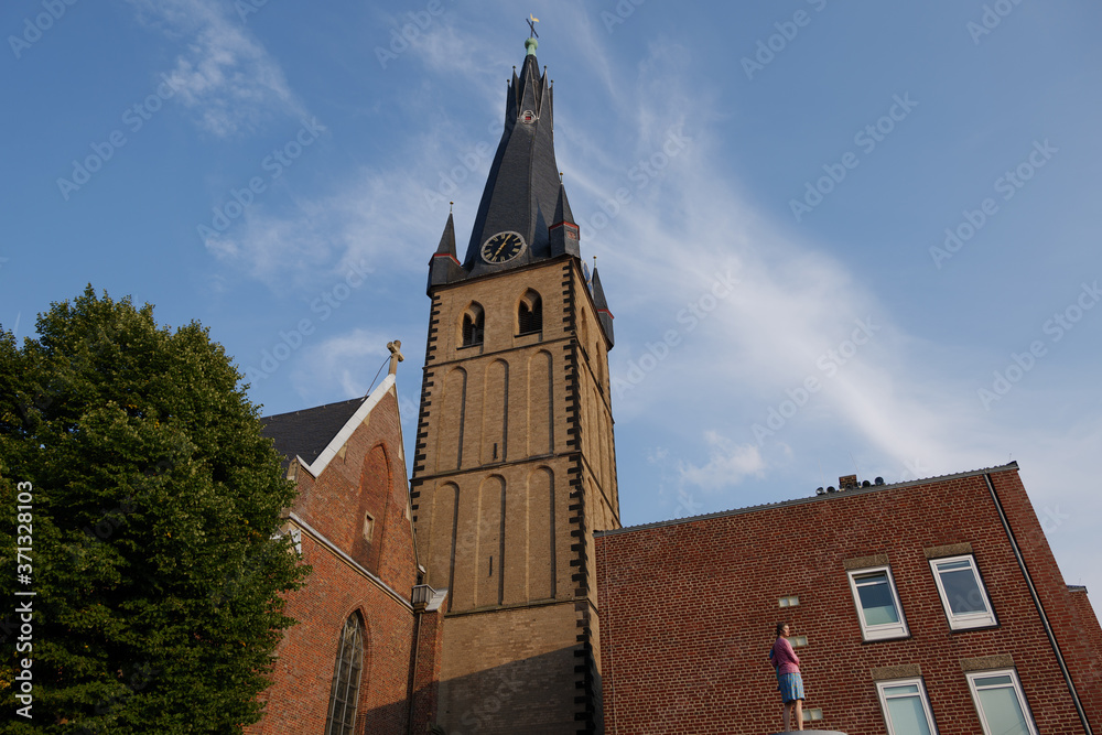 Low angle view of tower of St. Lambert and Low angle view of tower of St. Lambert and