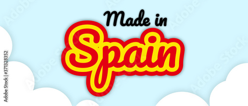 Bold stroke text style "Made in Spain" vector illustration. Text in country flag colours, floating on editable/removable sky with clouds background.