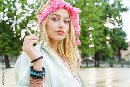 Photography Young blonde caucasian woman standing outdoor with cigarette - Beautiful girl ho