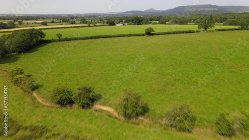 Aerial view of fields and Roseberry Topping in summer in North Yorkshire, England, United Kingdom photo