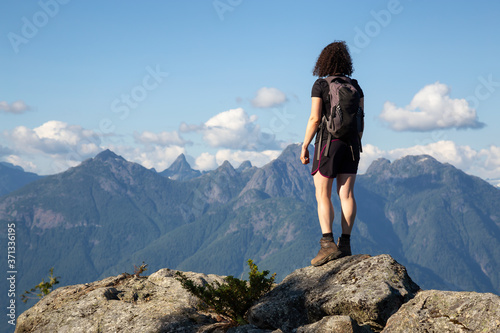 Adventurous Girl Hiking on top of Tin Hat Mountain  part of the popular Sunshine Coast Hiking Trail in Powell River  British Columbia  Canada. Concept  Explore  Adventure  Travel