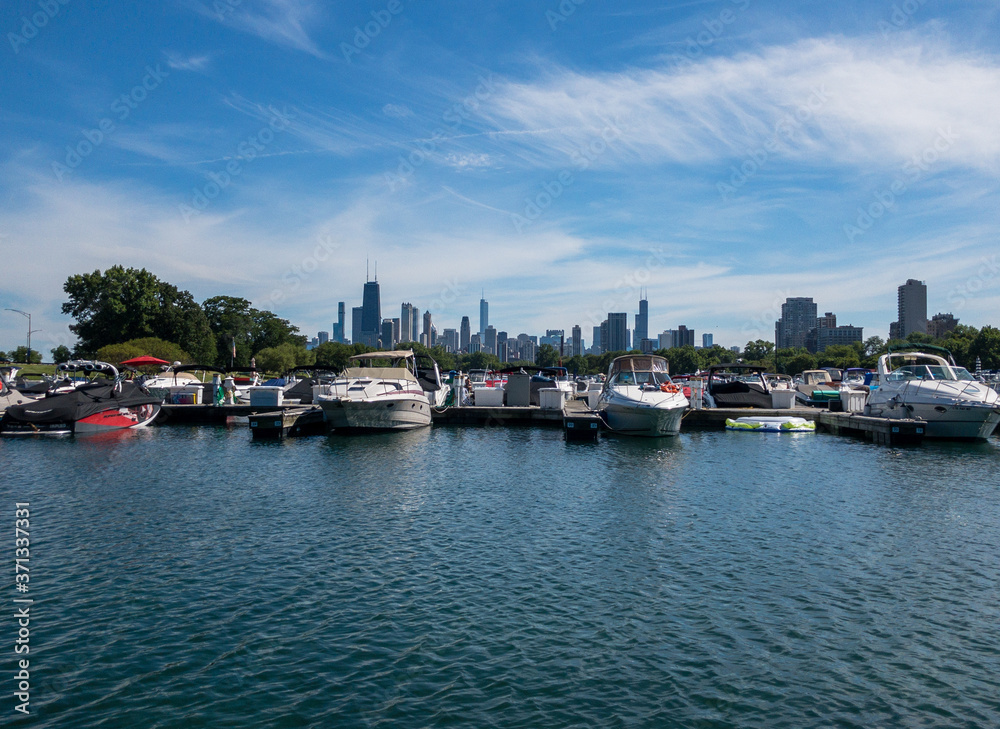 view of downtown Chicago skyline past  Diversey Harbor boats in Chicago, Illinois