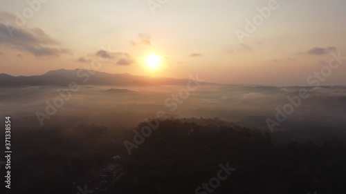 Aerial view of sunrise with light mist. Mount Ireng Gunungkidul Yogyakarta