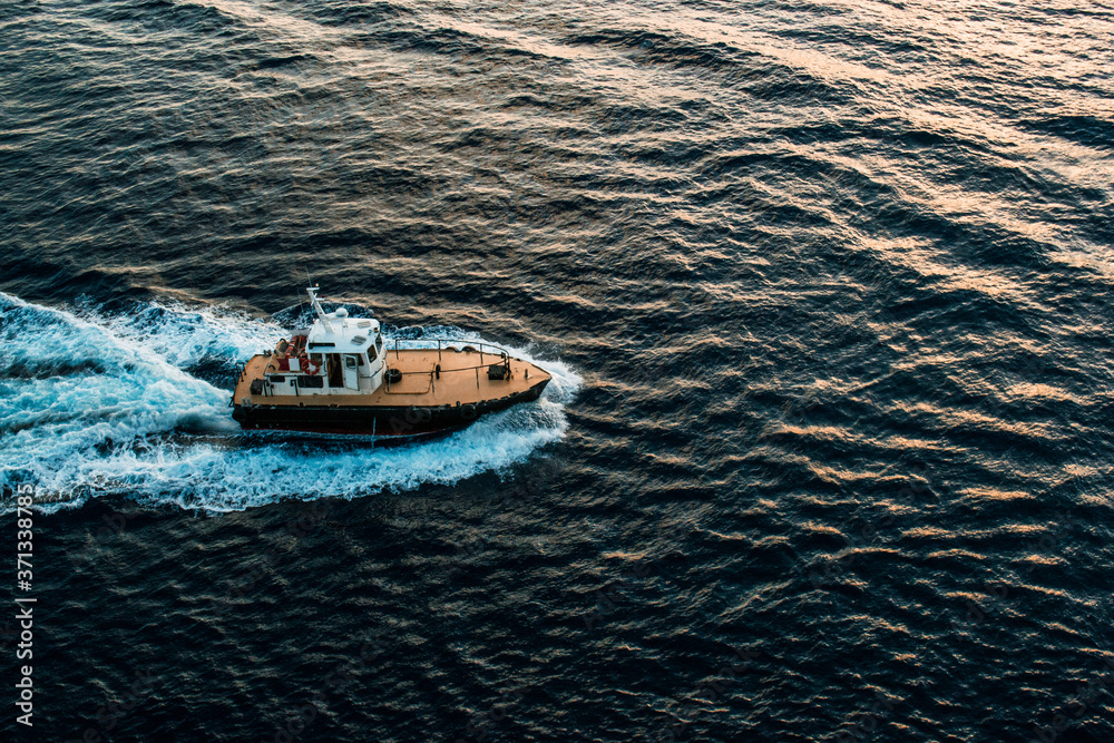 Naklejka premium Tugboat at Sea