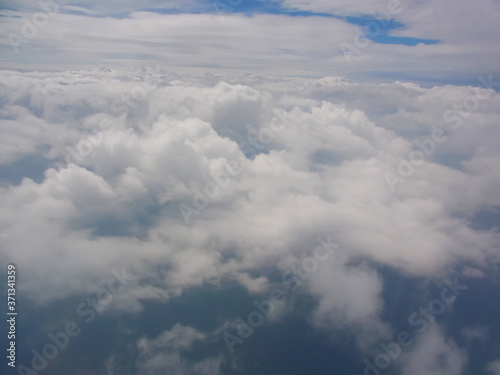 A beautiful cloud to stare at from the sky and the earth which peeps out from the interval