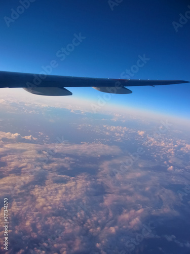 The cloud which bathes in the beautiful sea and setting sun spreading under eyes