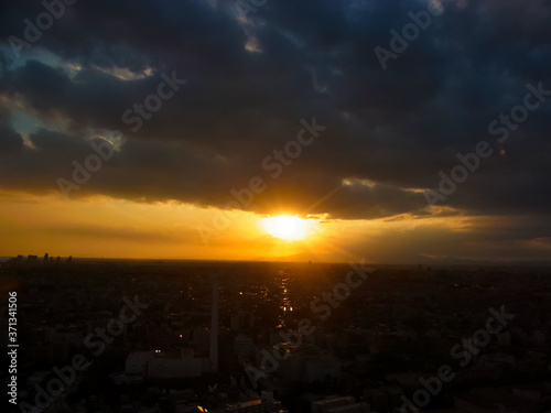 The sun of the orange and the dark earth and cloud