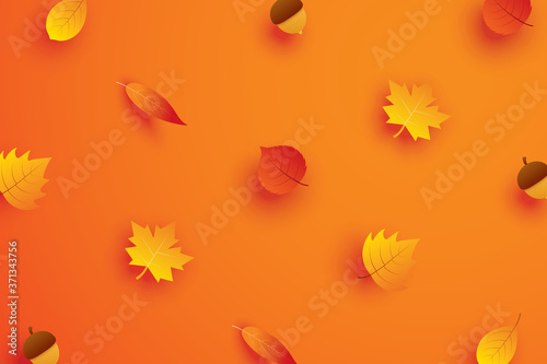Autumn leaves in paper art style on orange background.
