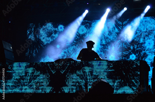 a dj playing at the night in a show