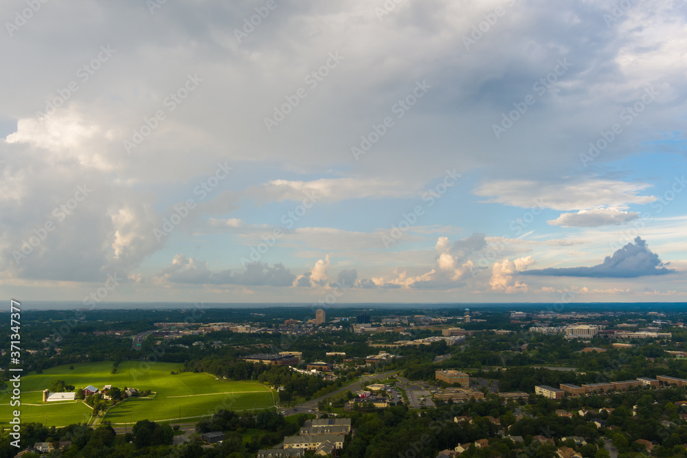 Fototapeta premium late afternoon cumulus and cumulonimbus clouds over Gaithersburg and Rockville, Montgomery County, Maryland.