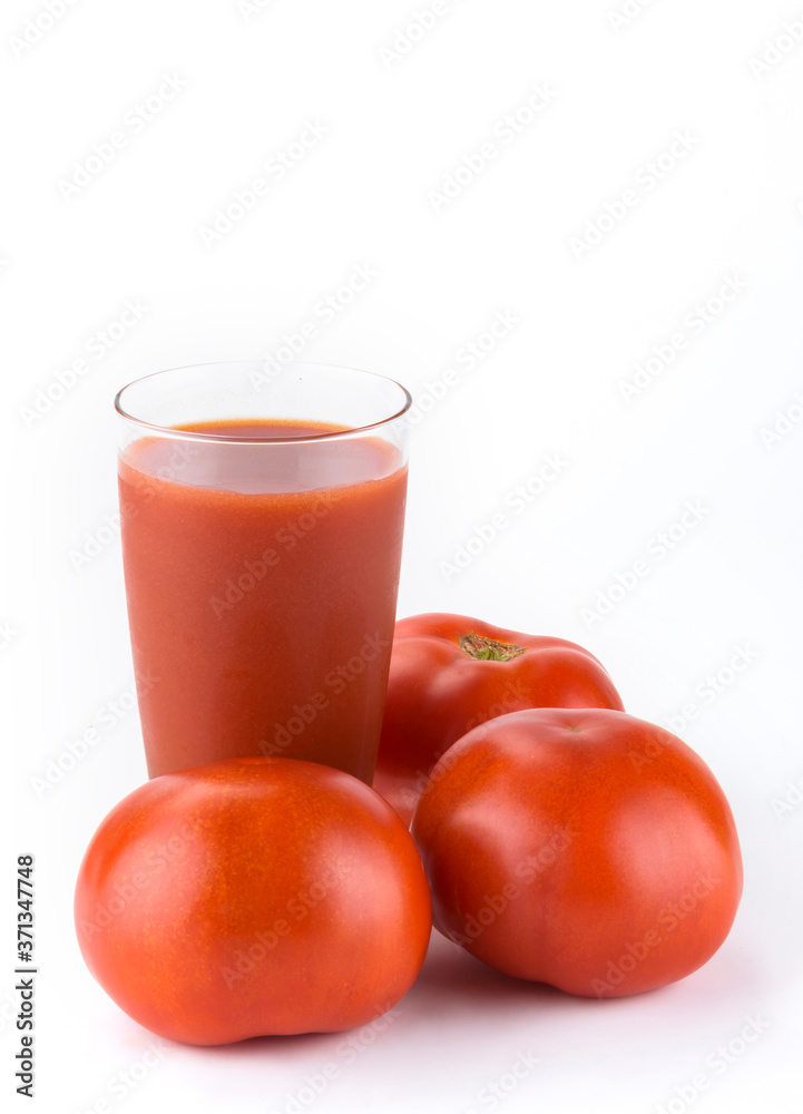 Tomato juice. Ripe tomatoes and glass of tomato juice on white background Tomato juice. Ripe tomatoes and glass of tomato juice on white background