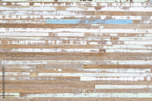 Grunge old wooden furniture with peeling shabby blue and green paint wood surface textured abstract background. Old rustic vintage retro wooden background.