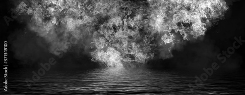 Panoramic view black and white fire. Perfect explosion effect for decoration and covering on black background. Concept burn flame and light texture overlays. Reflection on water.