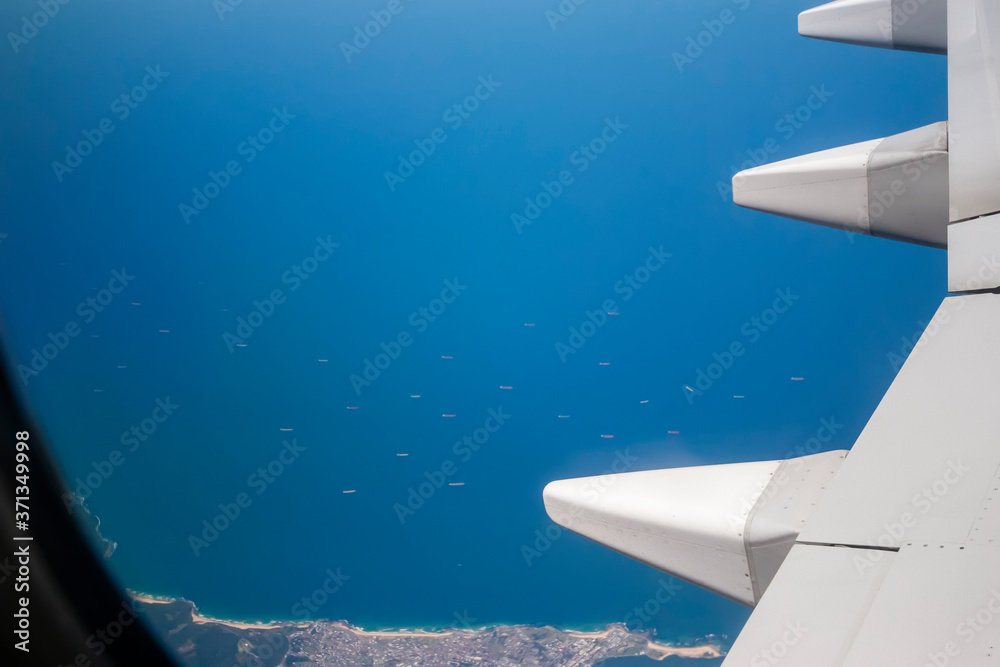 Fototapeta premium Looking out the window of a plane