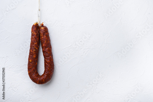 Spanish chorizo sausage on white background with space for text