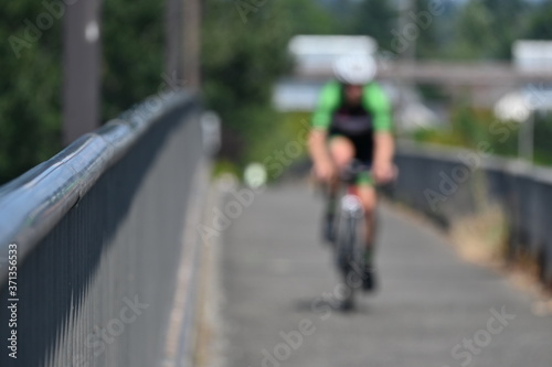 bicycle rider on bridge  pathway