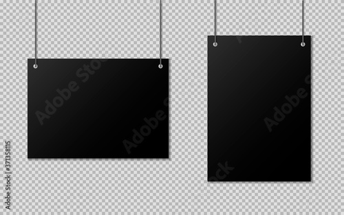 Blanks of black paper hanging on threads. A4 blank paper.