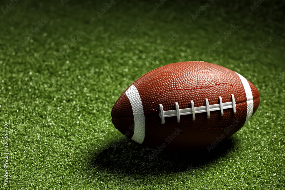 Rugby ball on green grass Rugby ball on green grass