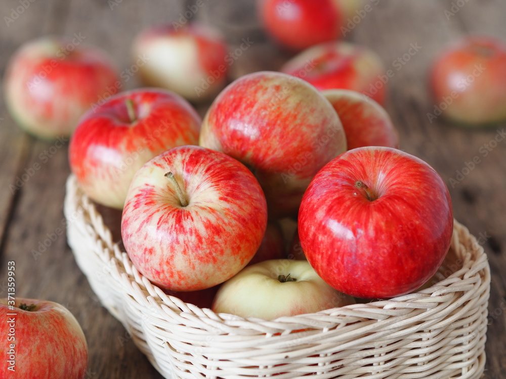 Agricultural apple background. Red early ripe apples on a wooden background. Agricultural apple background. Red early ripe apples on a wooden background.