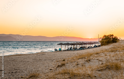 Scenic sunset in Plaka beach in Naxos island, Cyclades, Greece.