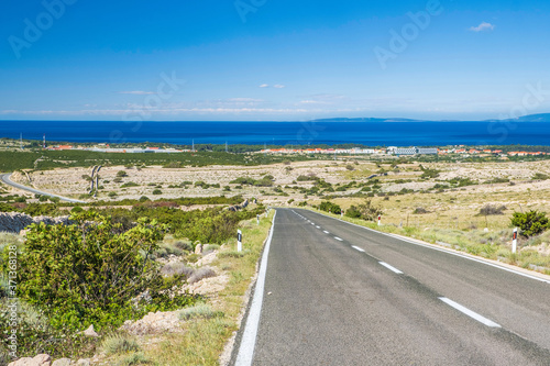 Scenic road beautiful island of Pag to town of Novalja in Croatia  Adriatic landscape