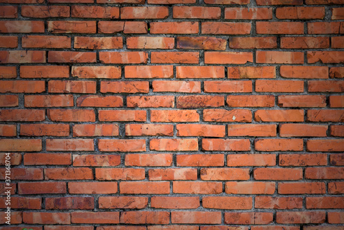 Wall of red bricks as background