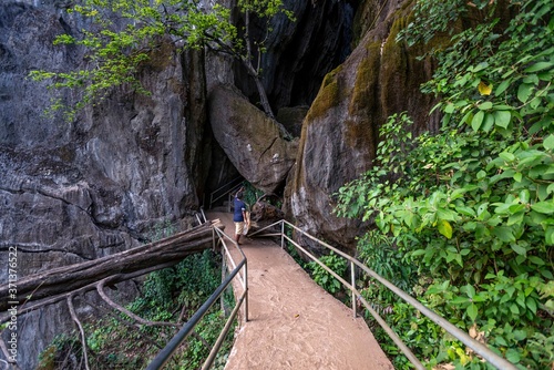 magical trails through a mountain forest in a tourist place Yana Rocks this is an old stone formation with caves inside. Karnataka. India. Indian tourism concept photo
