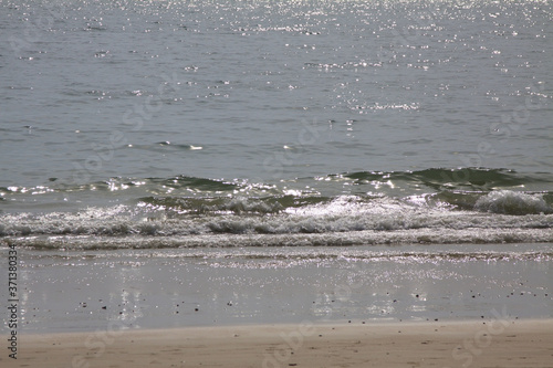 Wave on the sea. Asian seashore. Sandy beach. Summer landscape. Relax on the coastline.