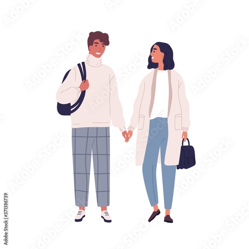 Walking happy modern young people. Couple in love, holding hands and looking ...