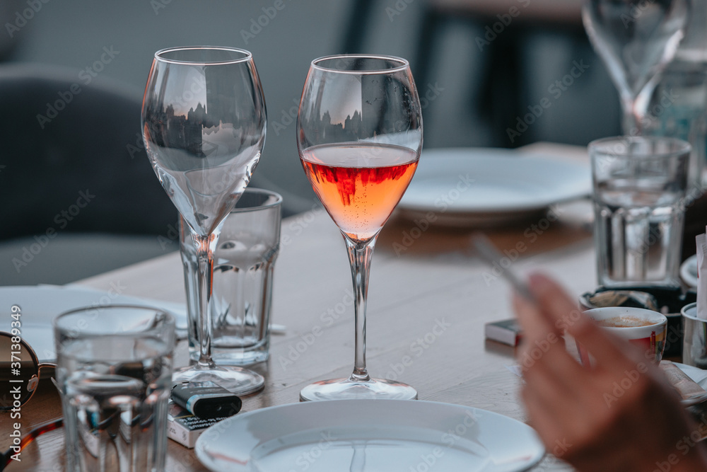 Glasses of white and pink sparkling wine on the table at the restaurant. Special wine tasting. Glasses of white and pink sparkling wine on the table at the restaurant. Special wine tasting.